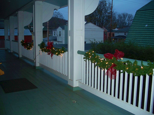 Upper veranda decorated for Christmas at Azalea Manor Bed and Breakfast in Madison Historic District, Madison Indiana 47250
