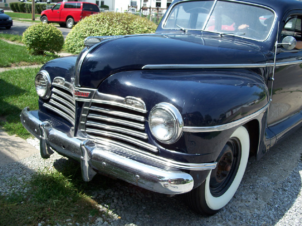 Picture of a 1942 Plymouth P14S Deluxe (4 door) automobile, a WWII staff car.
