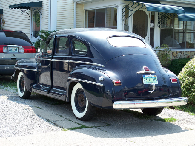 Picture of a 1942 Plymouth P14S Deluxe (4 door) automobile, a WWII staff car.